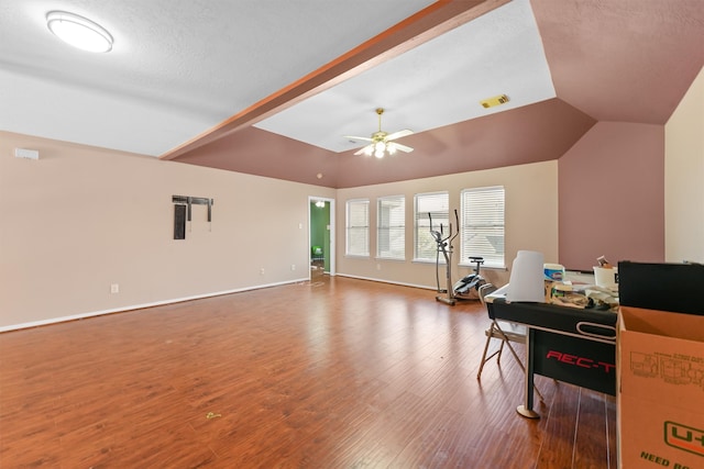 interior space with a textured ceiling, lofted ceiling, ceiling fan, and hardwood / wood-style flooring