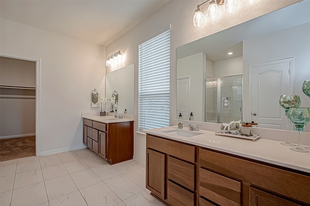 bathroom featuring walk in shower and vanity