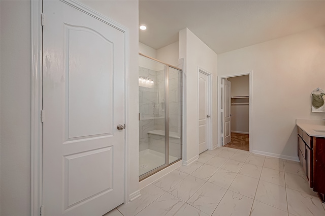 bathroom featuring vanity and an enclosed shower