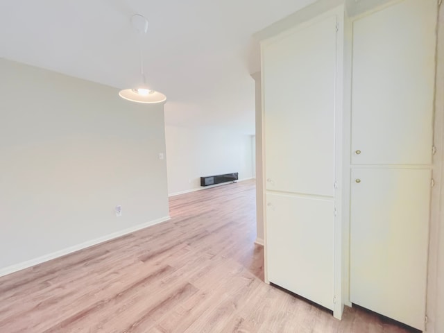 spare room featuring light wood-type flooring