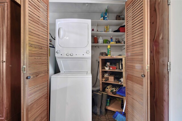 laundry area with stacked washer / dryer