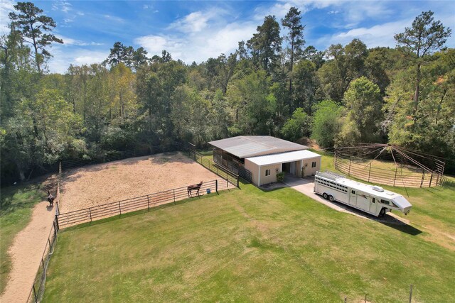 birds eye view of property with a rural view