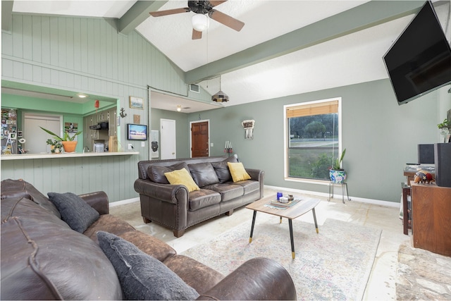 living room featuring ceiling fan and lofted ceiling with beams