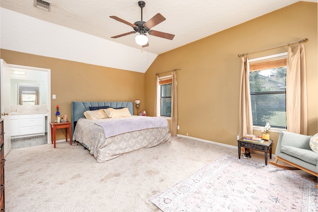 carpeted bedroom with vaulted ceiling, ceiling fan, and a textured ceiling