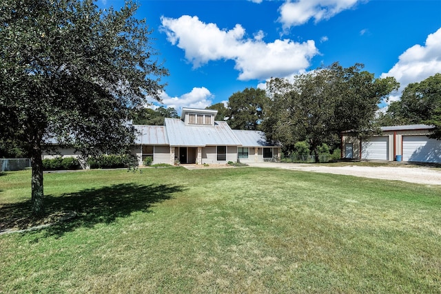 view of front facade with a garage and a front lawn