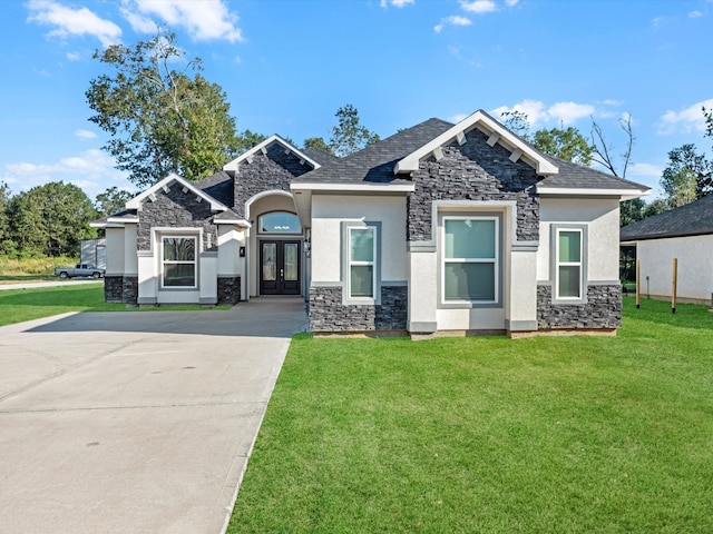 view of front of house with french doors and a front yard