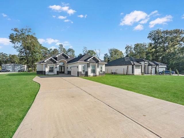 view of front facade featuring a front yard and a garage