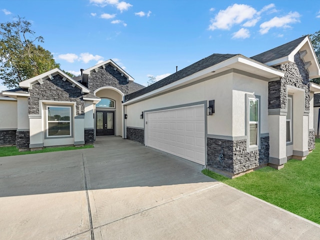 view of front of home featuring french doors and a garage