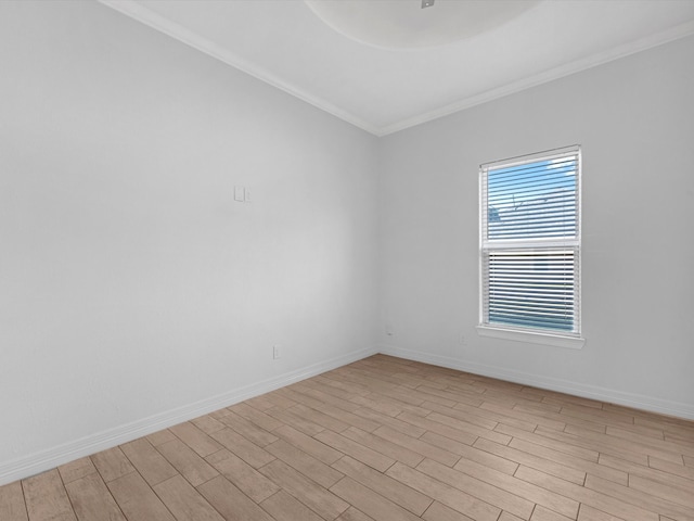 unfurnished room featuring crown molding and light hardwood / wood-style flooring