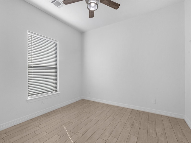 empty room featuring ceiling fan and light hardwood / wood-style flooring