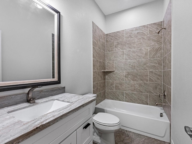 full bathroom featuring vanity, toilet, and tiled shower / bath