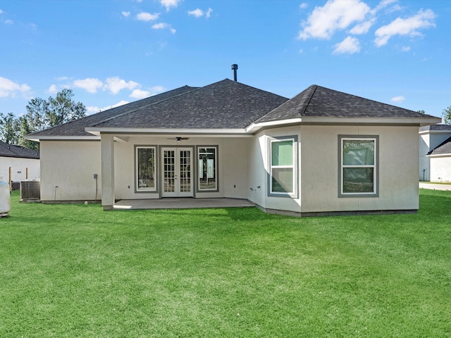 back of house with french doors, a patio, central AC unit, and a lawn