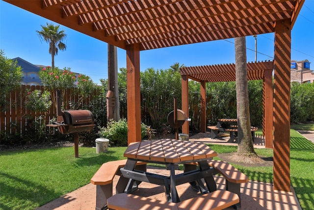 view of patio featuring outdoor dining area, fence, and a pergola