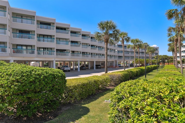 6102 Seawall Blvd Unit 294, Galveston, TX 77551 - view of apartment building / complex with covered parking