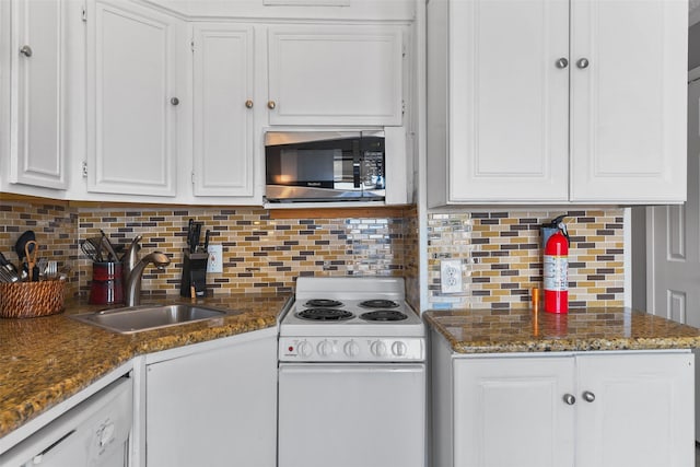 6102 Seawall Blvd Unit 294, Galveston, TX 77551 - kitchen with white appliances, a sink, white cabinetry, and tasteful backsplash