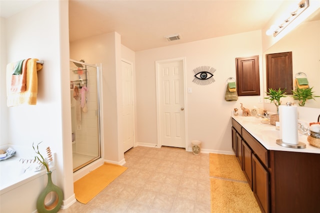 bathroom with vanity and an enclosed shower