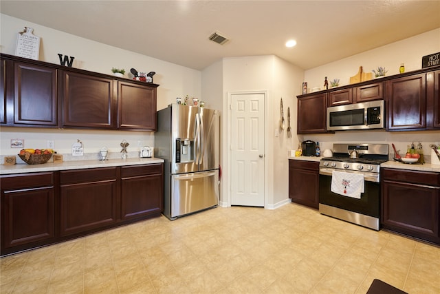 kitchen with dark brown cabinets and stainless steel appliances