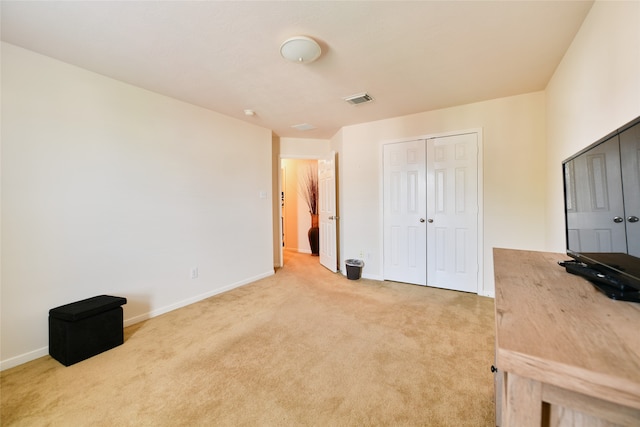 unfurnished bedroom with light colored carpet