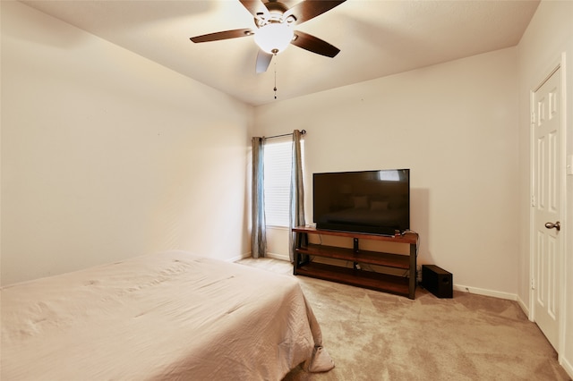 bedroom featuring ceiling fan and light colored carpet