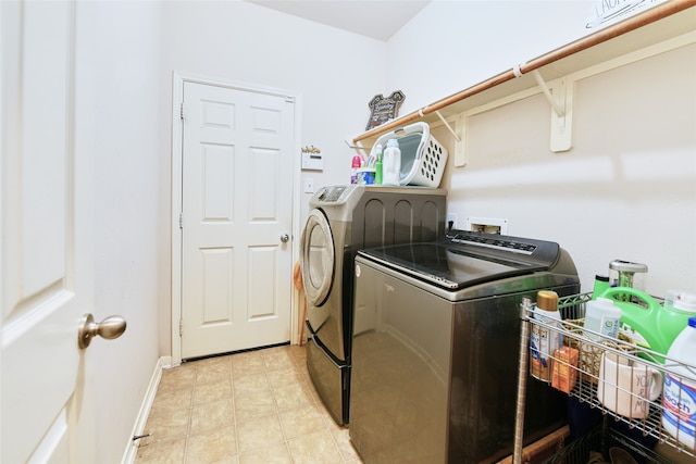 washroom featuring independent washer and dryer