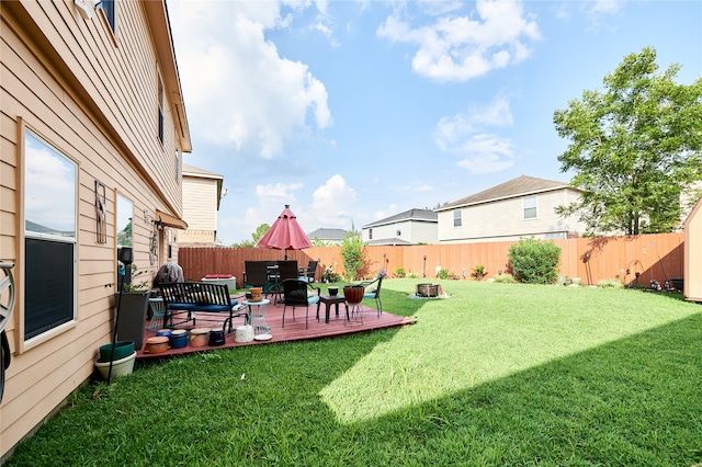 view of yard featuring a wooden deck