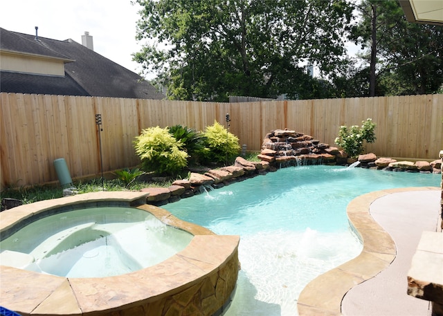 view of swimming pool featuring an in ground hot tub and pool water feature