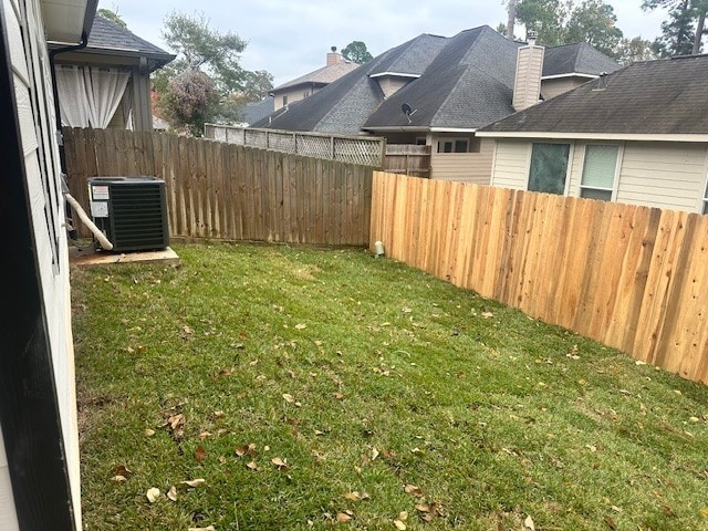 view of yard featuring central air condition unit