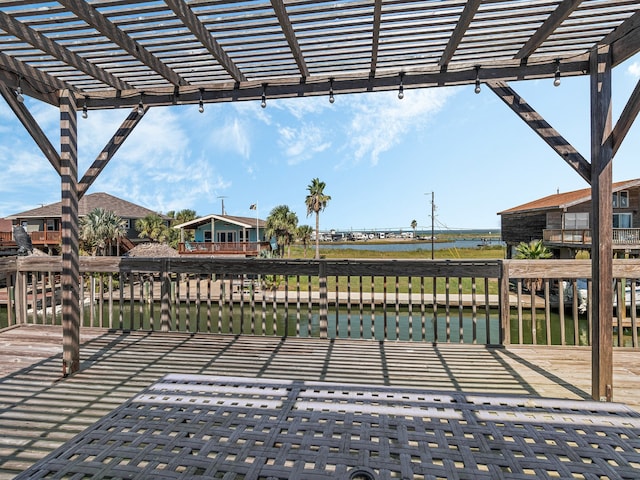 view of patio / terrace with a water view and a pergola