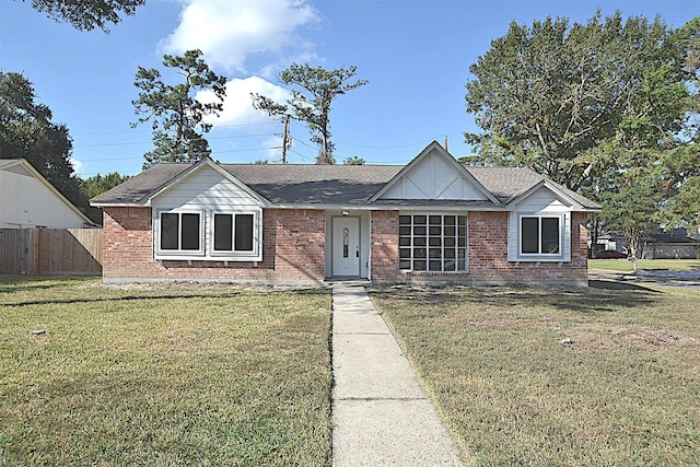 single story home with a front lawn