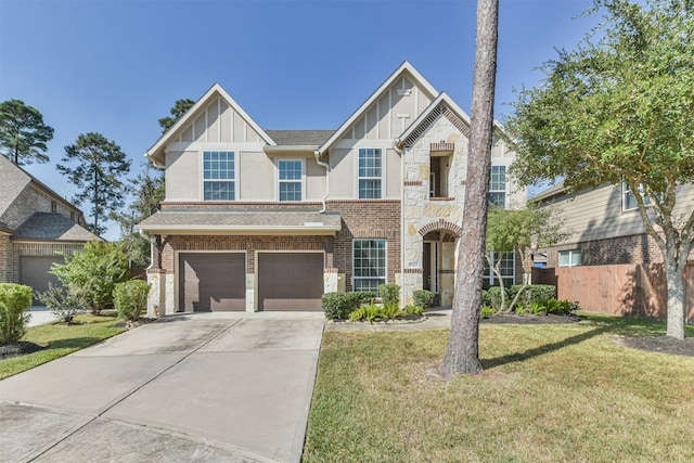 view of front of house with a garage and a front yard