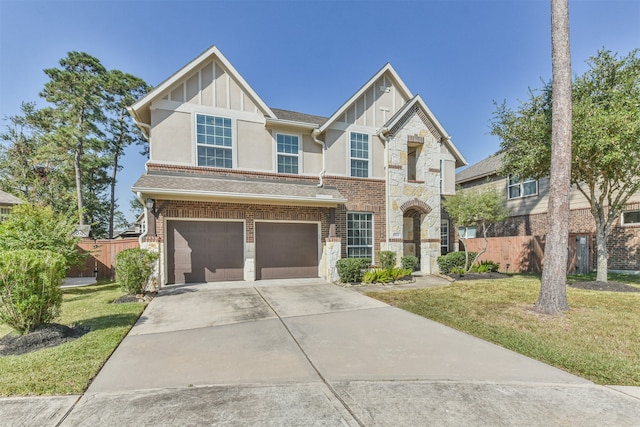 view of front of property featuring a front yard and a garage