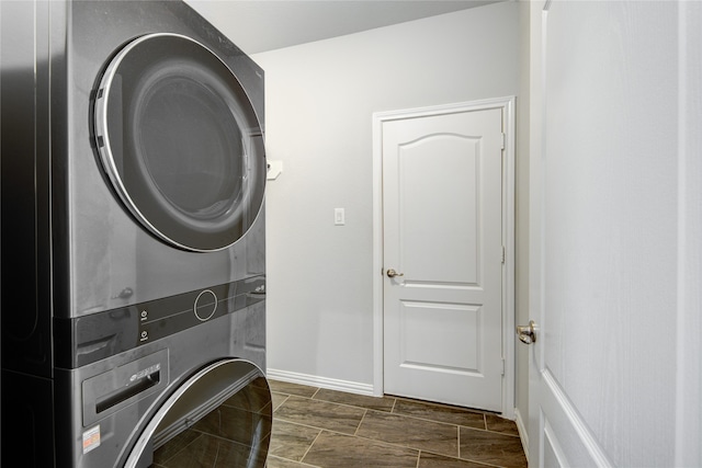 laundry room with stacked washer / drying machine