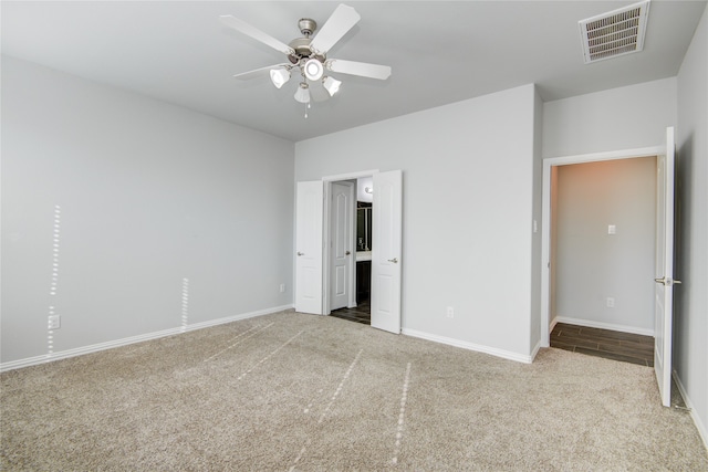 unfurnished bedroom with light carpet and ceiling fan