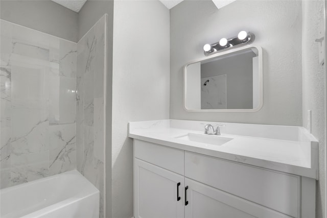 bathroom featuring vanity and tiled shower / bath combo