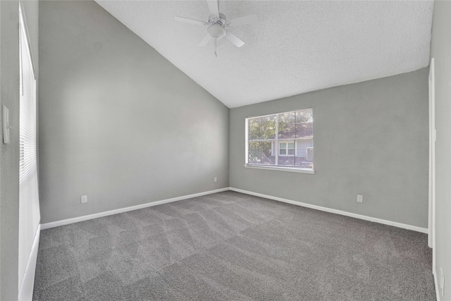 spare room with ceiling fan, carpet floors, vaulted ceiling, and a textured ceiling