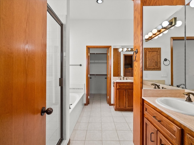 bathroom with vanity, separate shower and tub, and tile patterned floors