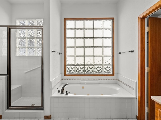 bathroom featuring vanity and shower with separate bathtub