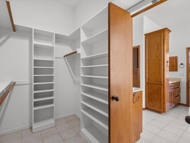 walk in closet featuring light tile patterned floors