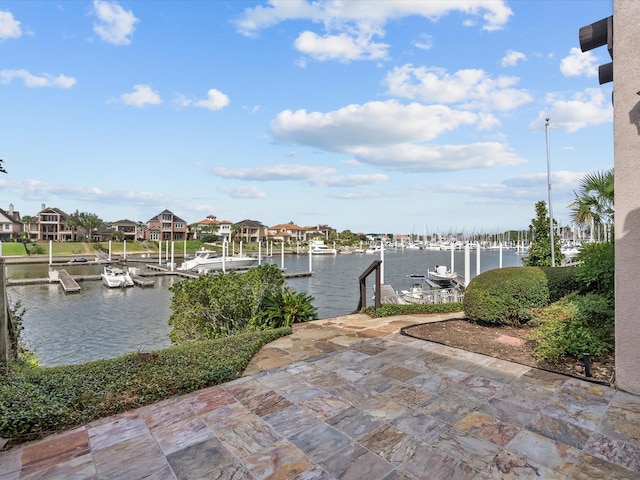 exterior space with a water view and a boat dock