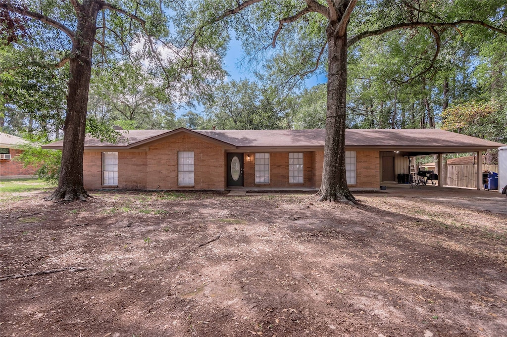 ranch-style home with a carport