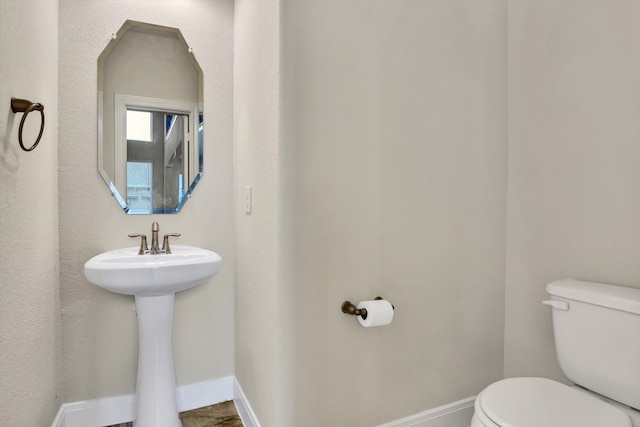 bathroom with sink and toilet