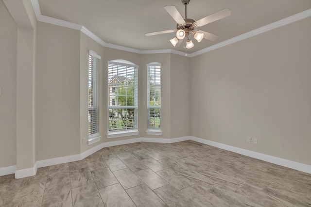 spare room with crown molding and ceiling fan