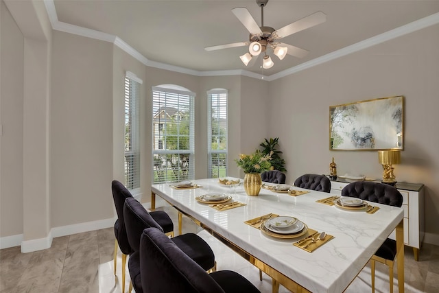 dining room with ornamental molding and ceiling fan