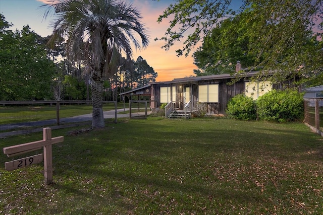 view of yard at dusk