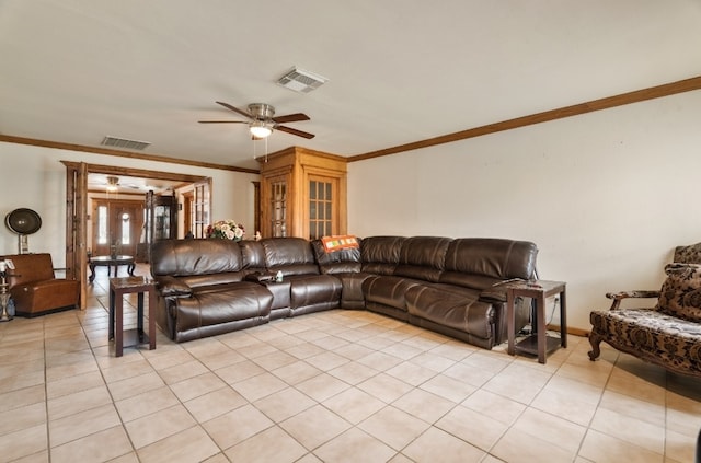 tiled living room featuring ornamental molding and ceiling fan