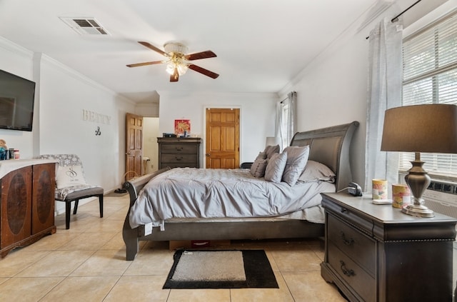 tiled bedroom with ceiling fan and crown molding