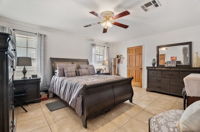 tiled bedroom featuring ornamental molding and ceiling fan