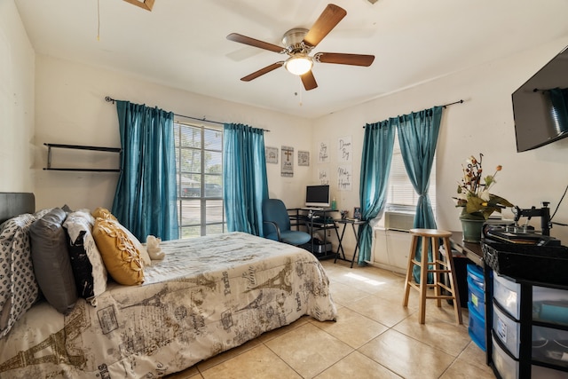 tiled bedroom featuring multiple windows, cooling unit, and ceiling fan