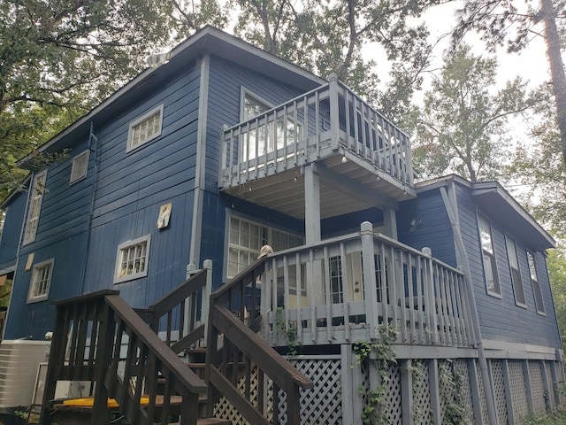 back of property featuring a deck