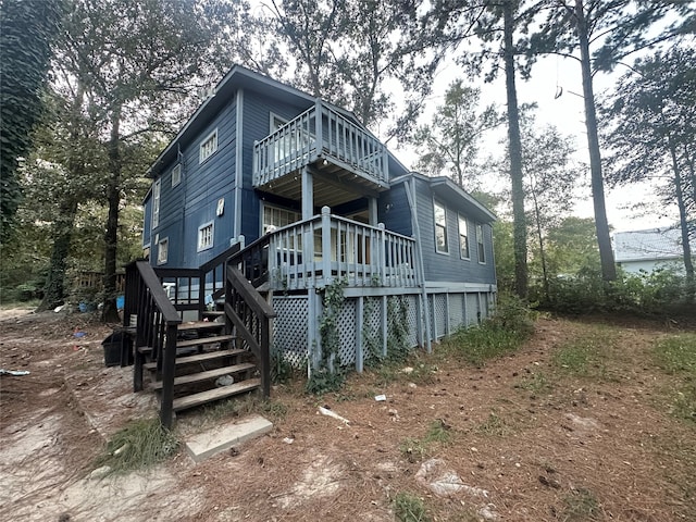 rear view of house with a deck